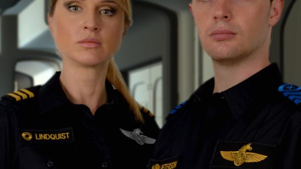 Two crew standing in starship corridor