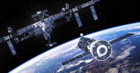 Spacestation in orbit above Earth-like planet with approaching spacecraft